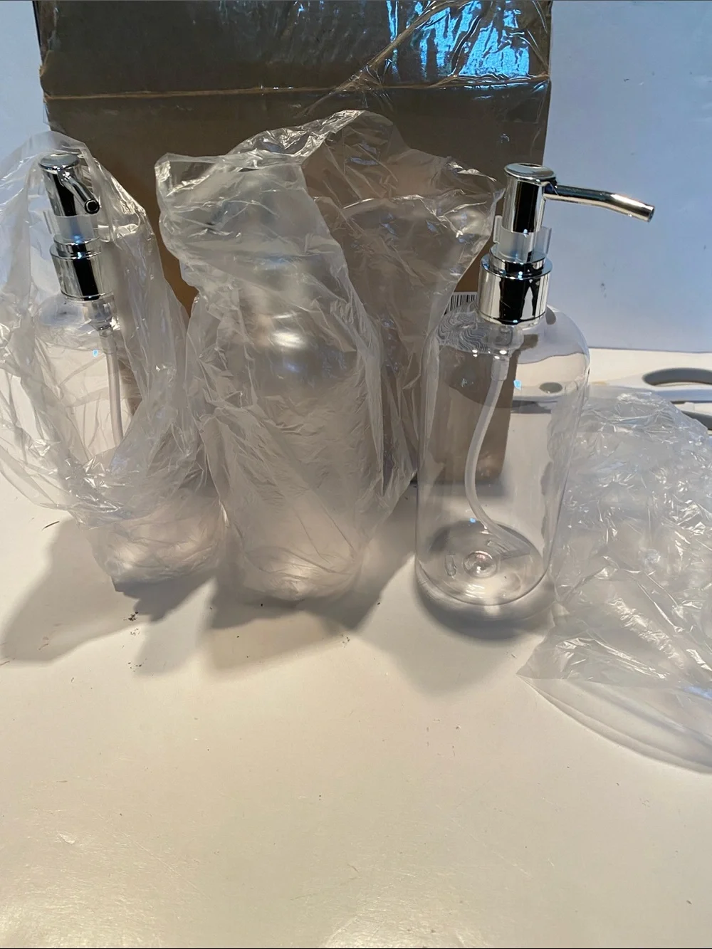 NIB Set of 3 Clear PET Plastic Round Bottles with Silver Pumps